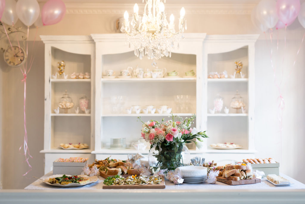A french dresser used as a candy buffet for sweet treats to welcome baby