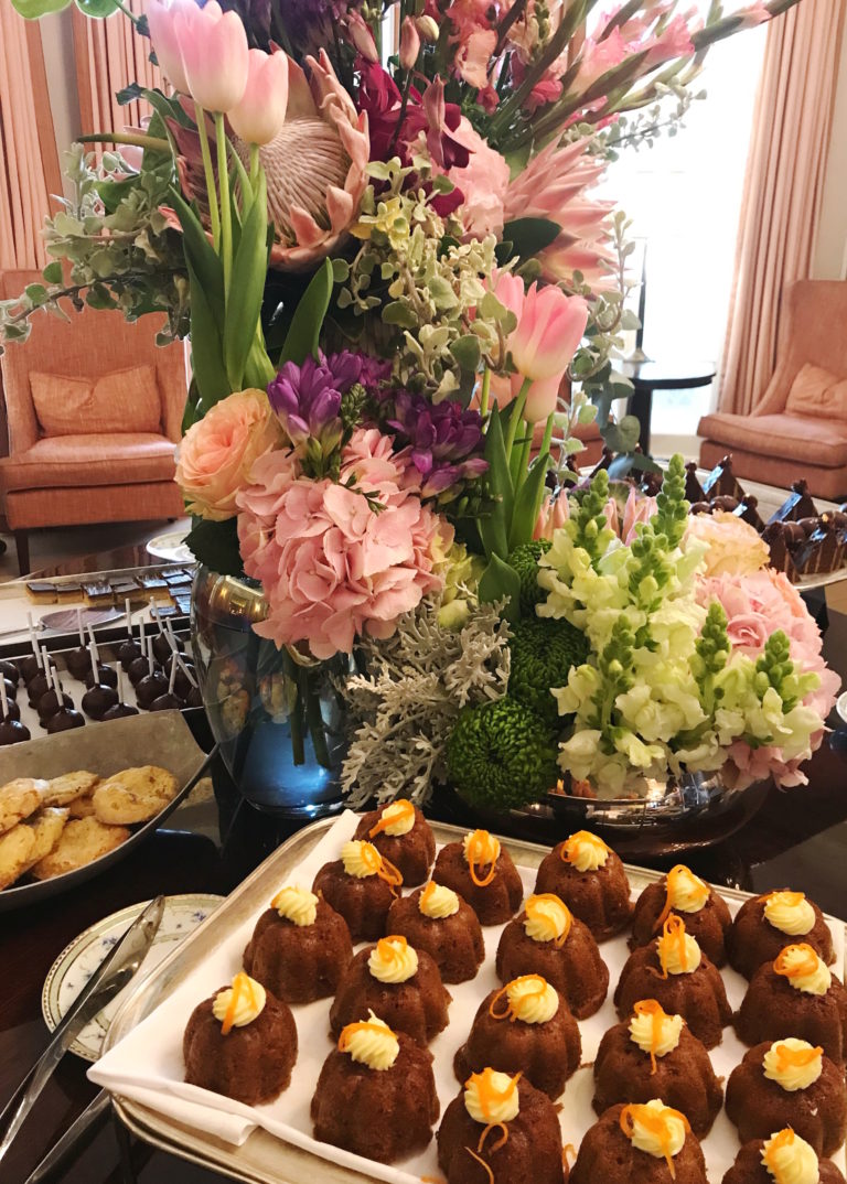 A beautiful, elaborate floral display on the sweet treats table et the Belmond Mount Nelson Hotel