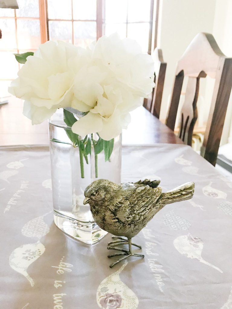 Heart shaped vase, white roses silver bird