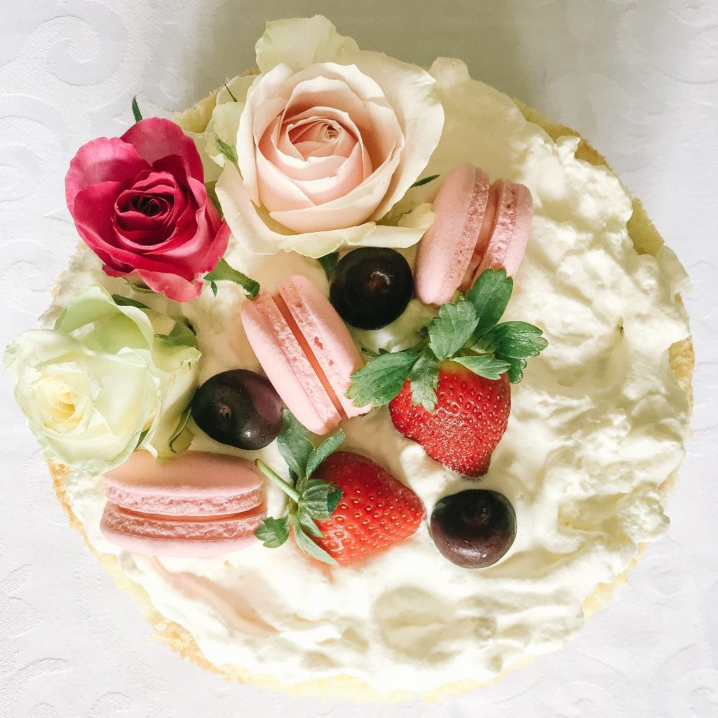A simple sponge cake for Valentine's Day - simply decorated with roses, macarons and fresh fruit!