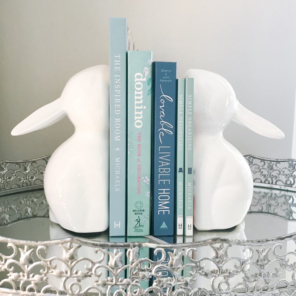Blue decor coffee table books with bunny bookends