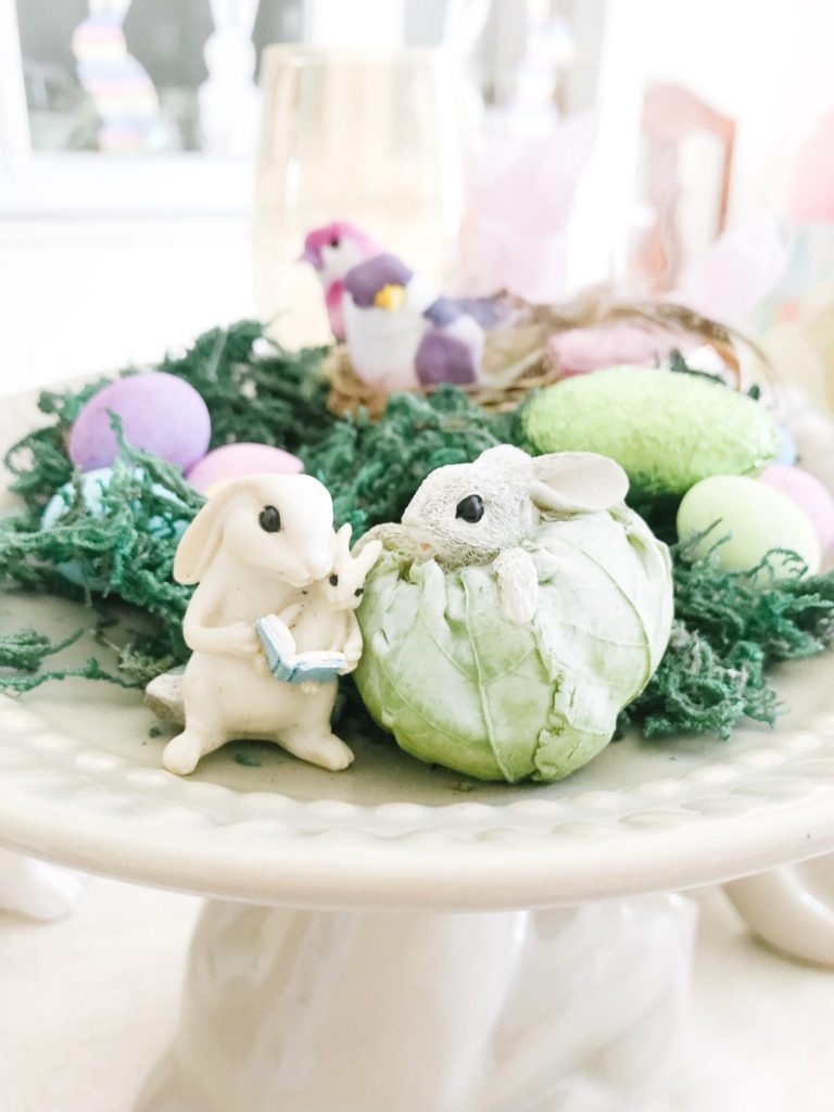 Miniature bunnies with moss and Easter eggs
