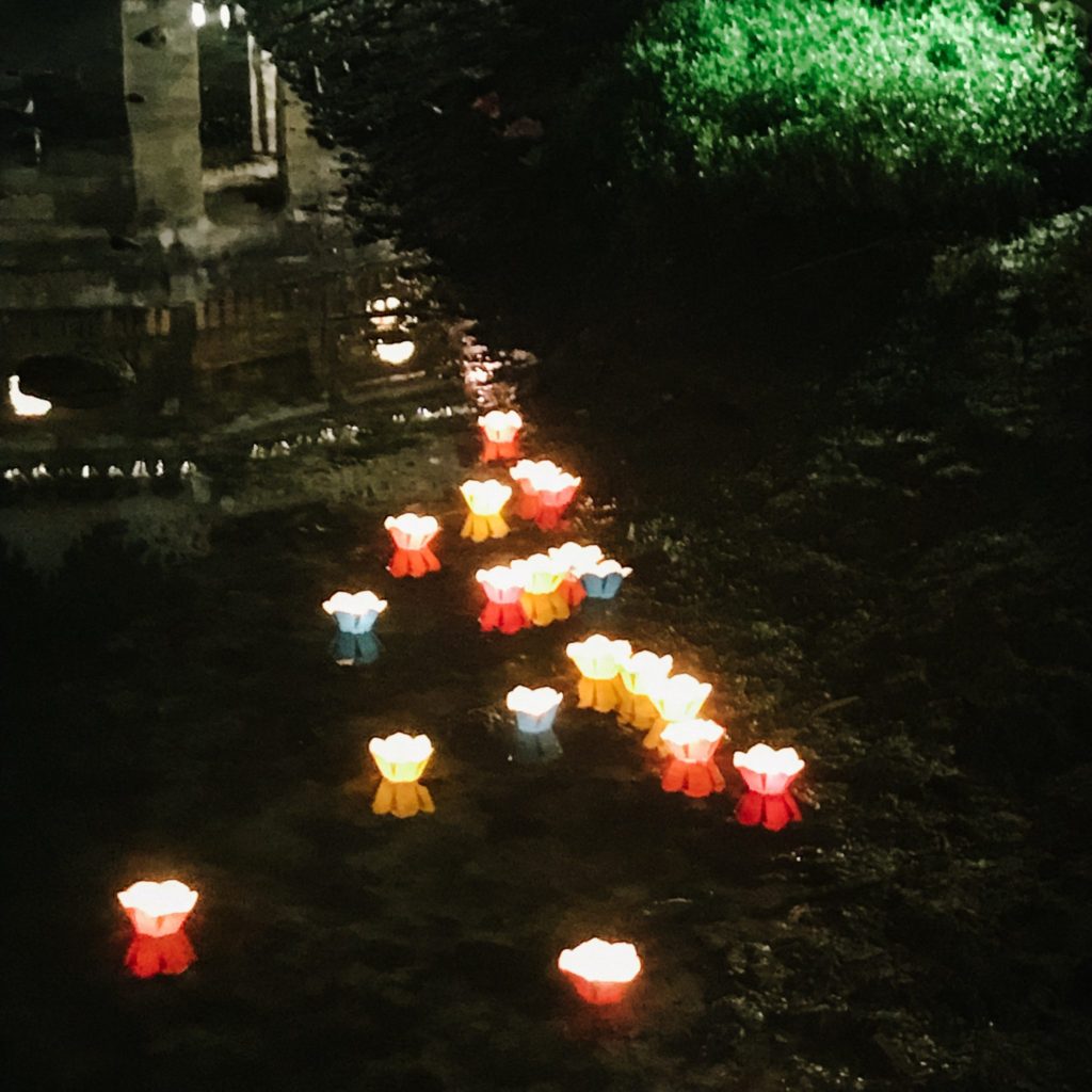 Lighting lanterns on the river for good luck in Hoi An, vibrant Vietnam