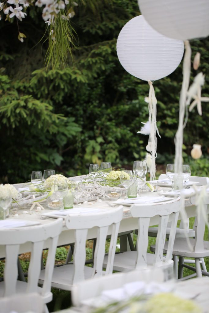 Garden party table setup in whites and neutrals