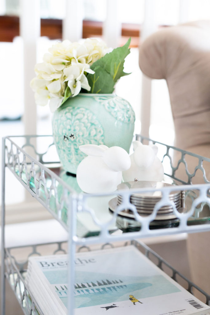 Silver  side table in living room with duck egg blue vase and hydrangeas