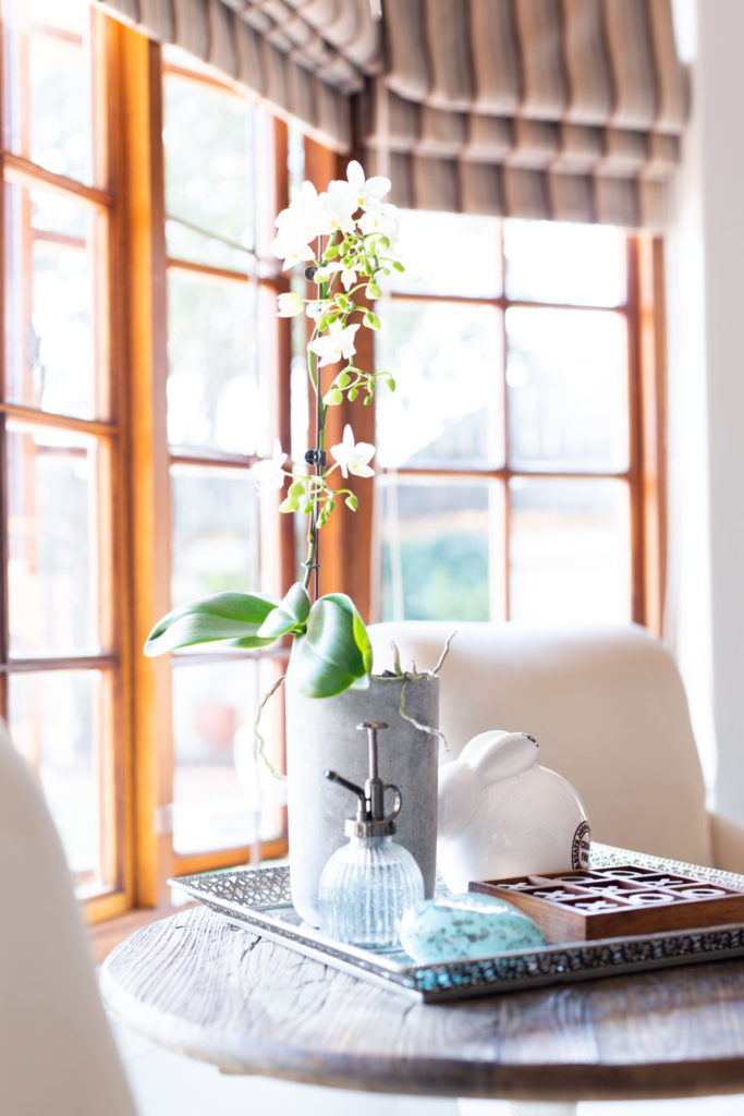 Side table in living room with decorative tray