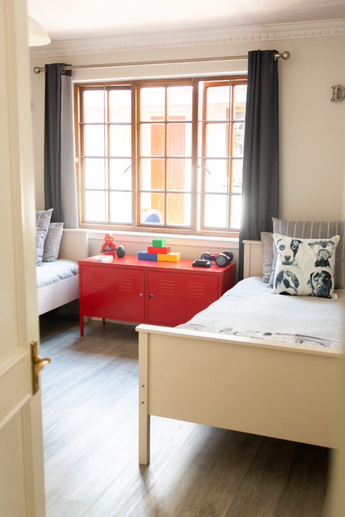 Boy's shared bedroom with red cabinet