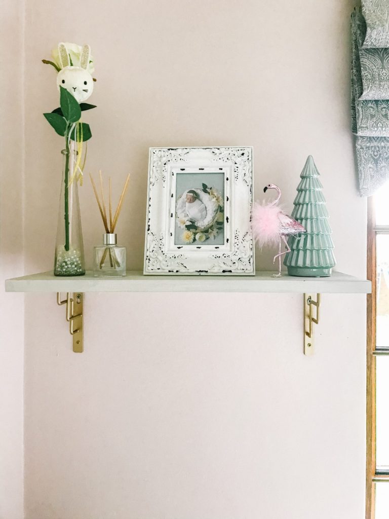 Flamingo and mint ceramic Christmas tree on shelf