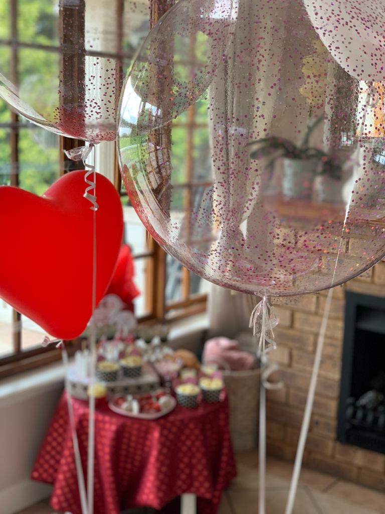 Heart-shaped and glitter-filled balloons for a Valentine's Day party!