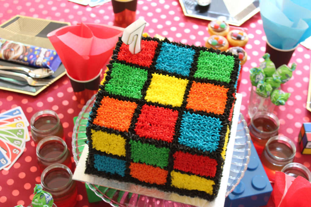 Table setting for a game's party - bright colours and UNO cards for table decor