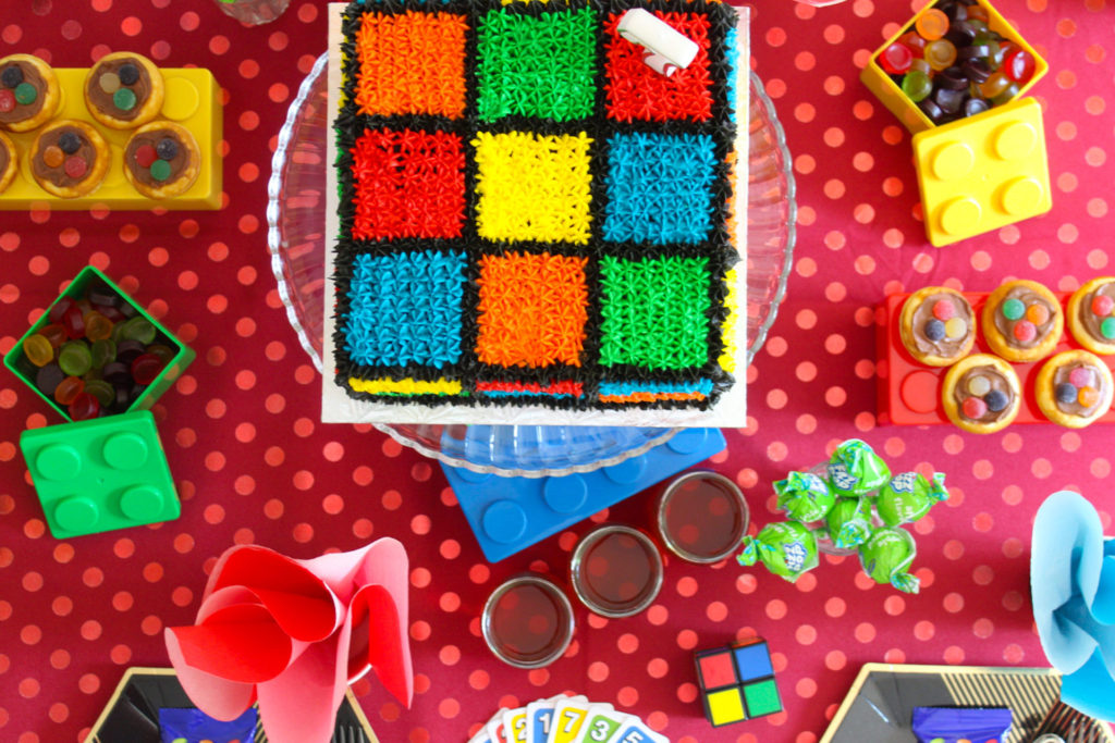 Table setting for a game's party - bright colours and UNO cards for table decor