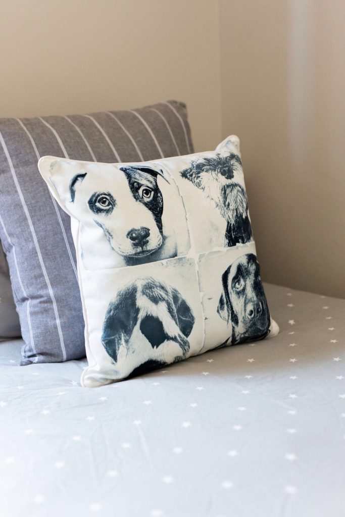 Dog cushions on a boy's bed